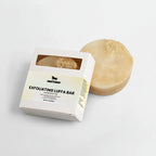 Exfoliating Luffa Bar with packaging on a light gray background