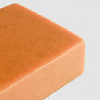 Orange bar of soap with 'suplifull' branding on a white background