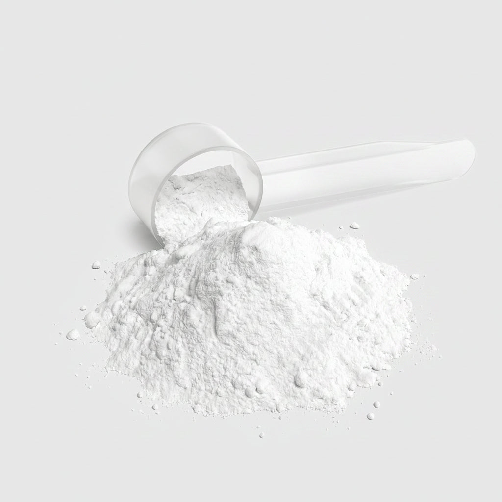 White powder in a clear plastic scoop on a white background