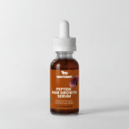 Peptide hair growth serum bottle with dropper on a light gray background