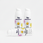 Two tubes of Nestdeer 10% Niacinamide Serum with floral design on a white background.