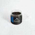 Jar of peppermint coffee scrub with Nestdeer branding on a light gray background