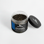 Jar of peppermint coffee scrub with Nestdeer branding on a white background