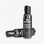 Nestider charcoal facial cleanser bottle with black cap on a white background