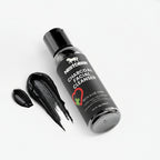 Bottle of NestDeer Charcoal Facial Cleanser with a black cap on a white background