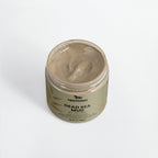 Jar of Dead Sea Mud with visible brand logo on a white background