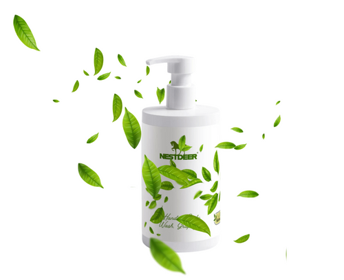 White bottle with green leaves on a white background