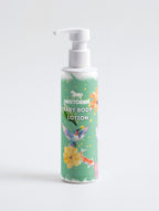 Baby body lotion bottle with colorful label on a white background